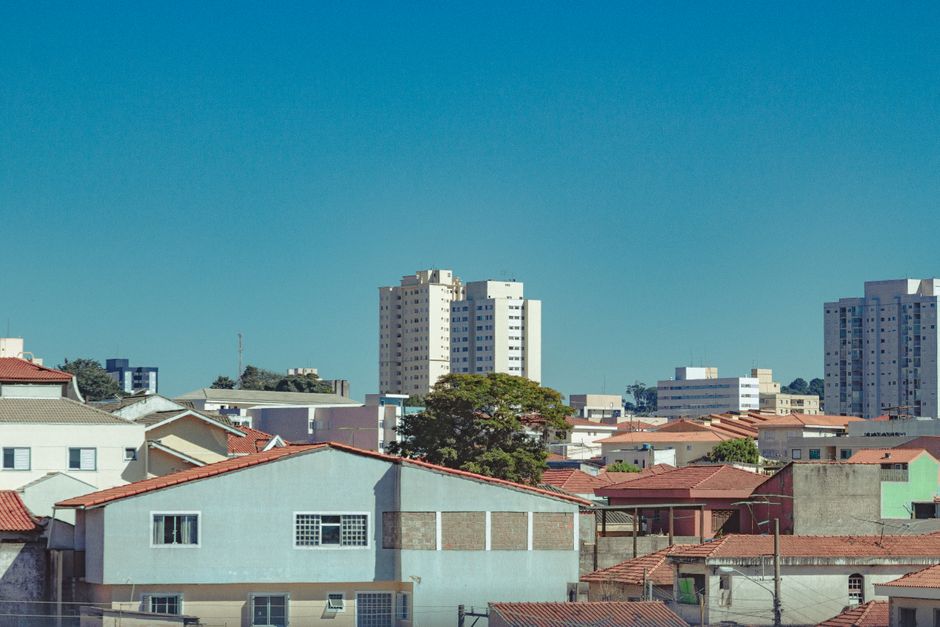 Residential neighborhood with multiple homes showing roof condition and property maintenance