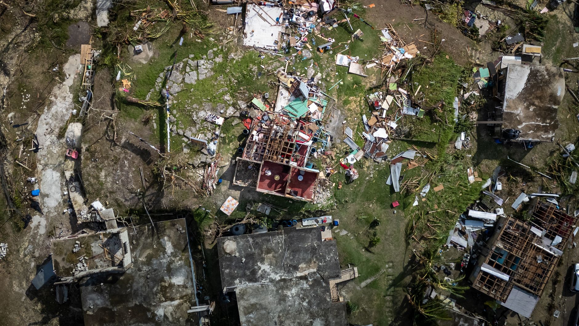 Roof damage showing wind-damaged shingles and deterioration